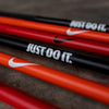 Image of Nike Strength Coated Premium Barbell - 20 kg / Orange Swoosh